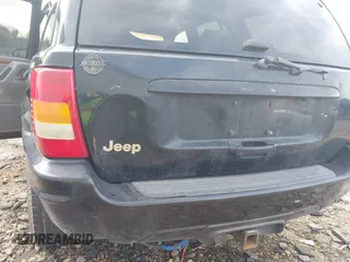 1999 Jeep Grand Cherokee Limited with VIN 1J4GW68S8XC588500, listed as a IAAI auction lot 41484787 with 161,961 mi miles. Bid and sale history available at carsss.com. Image 14.