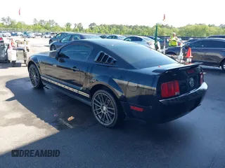 2005 Ford Mustang Deluxe with VIN 1ZVFT80N455122217, listed as a IAAI auction lot 42015083 with 154,396 mi miles. Bid and sale history available at carsss.com. Image 3.