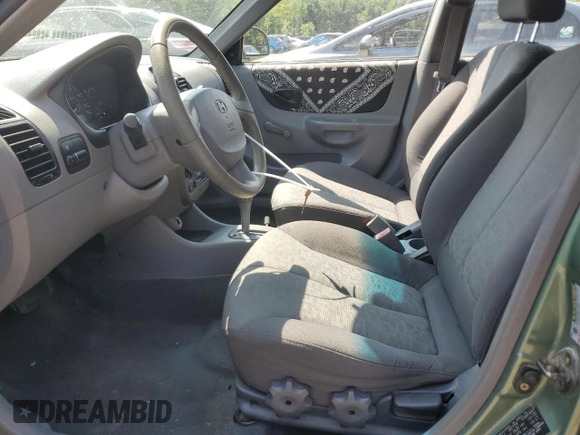 2005 Hyundai Accent GLS with VIN KMHCG45C35U622963, listed as a Copart auction lot 68292114 with 137,655 mi miles and Salvage Title. Bid and sale history available at carsss.com. Image 7.