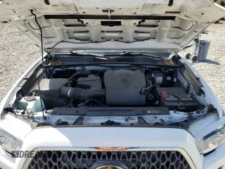 2019 Toyota Tacoma SR z VIN 3TMCZ5AN1KM263494, wystawiony jako Copart lot #54710695 z przebiegiem 57 216 mil mil oraz Szkoda całkowita • Salvage title. Historia ofert i sprzedaży dostępna na DreamBid. Obrazek 11.