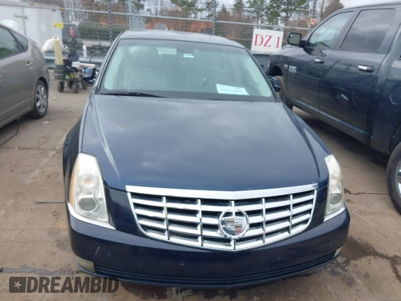 2009 Cadillac DTS 1SA z VIN 1G6KD57Y19U137656, wystawiony jako IAAI lot #41531439 z przebiegiem 103 151 mil mil oraz . Historia ofert i sprzedaży dostępna na DreamBid. Obrazek 6.