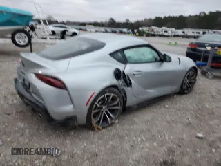 2022 Toyota GR Supra 2.0 with VIN WZ1DB2C09NW048380, listed as a Copart auction lot 87413024 with 0 mi miles and Salvage Title. Bid and sale history available at carsss.com. Image 3.