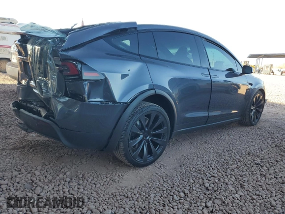 2023 Tesla Model X with VIN 7SAXCAE5XPF384061, listed as a Copart auction lot 86834084 with 6,974 mi miles and Salvage Title. Bid and sale history available at DreamBid. Image 3.
