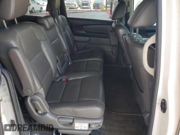 2014 Honda Odyssey Touring z VIN 5FNRL5H9XEB123330, wystawiony jako Copart lot #59023145 z przebiegiem 118 371 mil mil oraz Nie do naprawy • Non repairable. Historia ofert i sprzedaży dostępna na DreamBid. Obrazek 11.