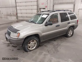 2003 Jeep Grand Cherokee Laredo with VIN 1J4GW48SX3C544237, listed as a IAAI auction lot 40823228 with 1 mi miles. Bid and sale history available at carsss.com. Image 2.