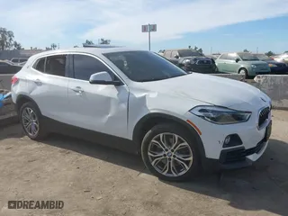 2020 BMW X2 sDrive28i with VIN WBXYH9C01L5P15004, listed as a IAAI auction lot 41128060 with 86,052 mi miles. Bid and sale history available at carsss.com. Image 1.