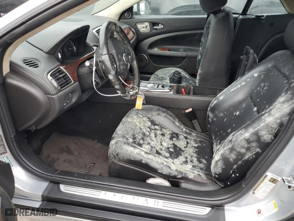 2010 Jaguar XK with VIN SAJWA4GB7ALB35518, listed as a Copart auction lot 74672434 with 0 mi miles and Salvage Title. Bid and sale history available at carsss.com. Image 7.