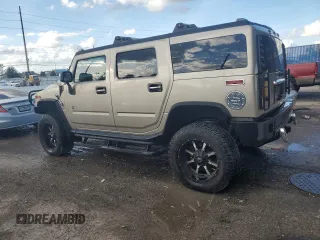 2003 Hummer H2 with VIN 5GRGN23U13H147071, listed as a Copart auction lot 82255674 with 272,215 mi miles and Salvage Title. Bid and sale history available at carsss.com. Image 2.