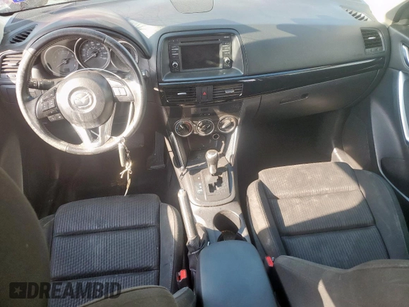 2014 Mazda CX-5 Touring with VIN JM3KE2CY1E0323298, listed as a Copart auction lot 50421685 with 214,739 mi miles and Salvage Title. Bid and sale history available at DreamBid. Image 8.