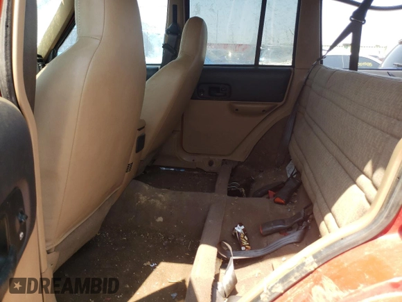 1999 Jeep Cherokee Sport z VIN 1J4FF68SXXL662401, wystawiony jako Copart lot #59698565 z przebiegiem Nie podano mil oraz Szkoda całkowita • Salvage title. Historia ofert i sprzedaży dostępna na DreamBid. Obrazek 10.