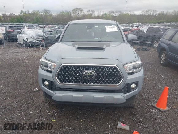 2019 Toyota Tacoma SR z VIN 3TMCZ5AN1KM206969, wystawiony jako IAAI lot #41951159 z przebiegiem 94 875 mil mil oraz . Historia ofert i sprzedaży dostępna na DreamBid. Obrazek 12.