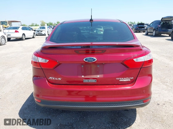 2013 Ford Focus Titanium with VIN 1FADP3J23DL334161, listed as a IAAI auction lot 41987758 with 117,665 mi miles and . Bid and sale history available at carsss.com. Image 16.