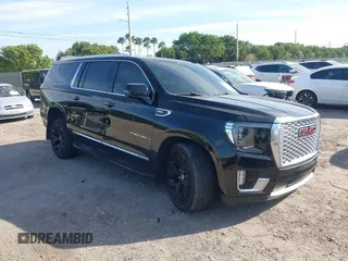 2021 GMC Yukon XL Denali with VIN 1GKS1JKLXMR210470, listed as a IAAI auction lot 41230529 with 125,296 mi miles. Bid and sale history available at carsss.com. Image 1.