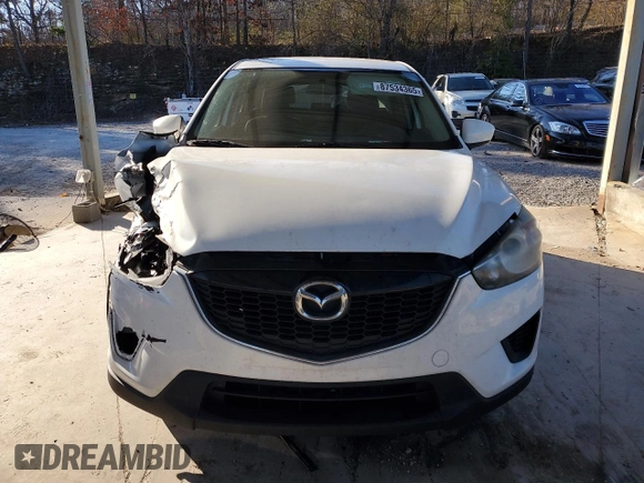 2014 Mazda CX-5 Sport with VIN JM3KE2BEXE0332590, listed as a Copart auction lot 87534365 with Not Provided miles and Salvage Title. Bid and sale history available at carsss.com. Image 5.