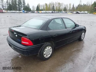 1997 Dodge Neon with VIN 1B3ES27C3VD261832, listed as a IAAI auction lot 41964028 with 220,237 mi miles. Bid and sale history available at carsss.com. Image 4.