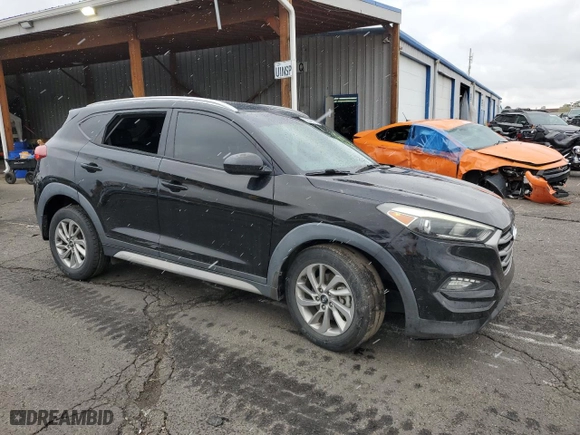 2017 Hyundai Tucson SE with VIN KM8J33A4XHU460779, listed as a Copart auction lot 52042115 with 96,459 mi miles and Salvage Title. Bid and sale history available at carsss.com. Image 4.
