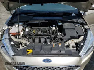 2018 Ford Focus SE z VIN 1FADP3F23JL303948, wystawiony jako Copart lot #55698915 z przebiegiem 85 500 mil mil oraz Szkoda całkowita • Salvage title. Historia ofert i sprzedaży dostępna na DreamBid. Obrazek 11.