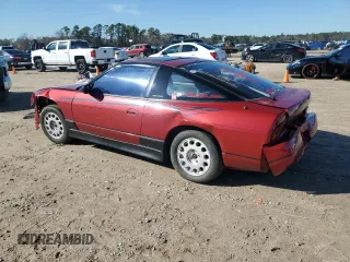 1989 Nissan 240SX z VIN RS13604765, wystawiony jako Copart lot #46514985 z przebiegiem 115 929 mil mil oraz Szkody całkowita. Historia ofert i sprzedaży dostępna na DreamBid. Obrazek 2.