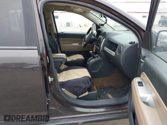 2014 Jeep Compass Latitude with VIN 1C4NJDEB5ED731057, listed as a IAAI auction lot 41938769 with 175,289 mi miles and . Bid and sale history available at carsss.com. Image 5.
