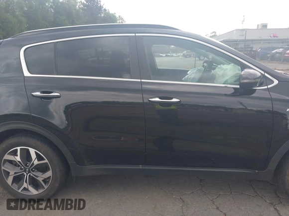 2021 Kia Sportage EX with VIN KNDPNCAC5M7848673, listed as a IAAI auction lot 42373684 with 108,409 mi miles and . Bid and sale history available at DreamBid. Image 13.