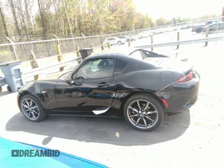 2021 Mazda MX-5 Miata Grand Touring z VIN JM1NDAM75M0451597, wystawiony jako IAAI lot #41932712 z przebiegiem 61 710 mil mil oraz . Historia ofert i sprzedaży dostępna na DreamBid. Obrazek 14.