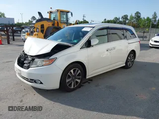 2014 Honda Odyssey Touring with VIN 5FNRL5H94EB001479, listed as a IAAI auction lot 41123678 with 147,269 mi miles and . Bid and sale history available at carsss.com. Image 2.