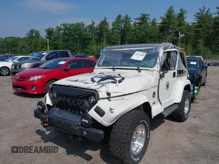 2002 Jeep Wrangler Sahara with VIN 1J4FA59S92P734763, listed as a IAAI auction lot 42411004 with 188,213 mi miles and . Bid and sale history available at DreamBid. Image 2.