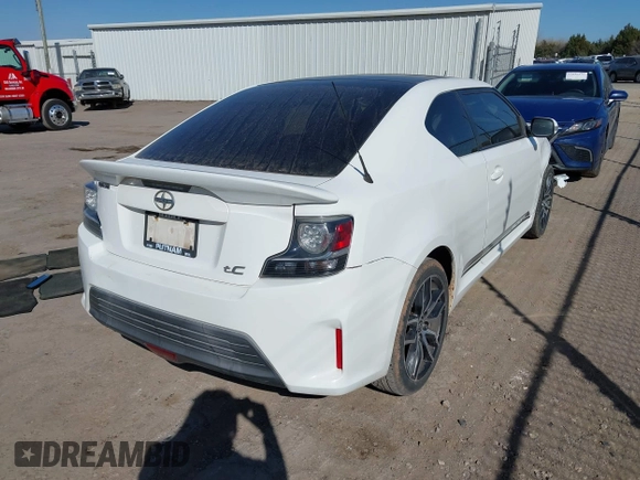 2014 Scion tC z VIN JTKJF5C74E3072410, wystawiony jako IAAI lot #41810965 z przebiegiem 147 164 mil mil oraz . Historia ofert i sprzedaży dostępna na DreamBid. Obrazek 4.