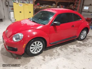 2016 Volkswagen Beetle Coupe 1.8T Wolfsburg Edition with VIN 3VWF17AT2GM619843, listed as a IAAI auction lot 41829023 with 147,716 mi miles. Bid and sale history available at carsss.com. Image 2.