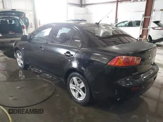 2008 Mitsubishi Lancer DE with VIN JA3AU26UX8U015865, listed as a IAAI auction lot 41108329 with 131,884 mi miles. Bid and sale history available at carsss.com. Image 3.