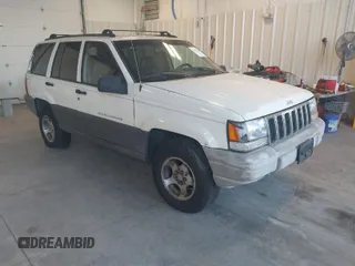 1997 Jeep Grand Cherokee Laredo with VIN 1J4GZ58SXVC552435, listed as a IAAI auction lot 41977888 with 143,832 mi miles. Bid and sale history available at carsss.com. Image 1.