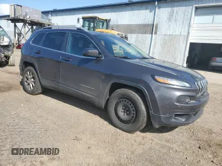 2015 Jeep Cherokee North with VIN 1C4PJMCSXFW582677, listed as a Copart auction lot 67999984 with 220,045 mi miles and Salvage Title. Bid and sale history available at carsss.com. Image 4.