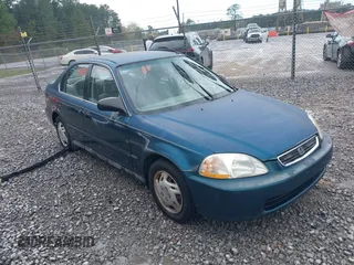 1997 Honda Civic LX with VIN 2HGEJ6674VH584711, listed as a IAAI auction lot 41848808 with 210,295 mi miles. Bid and sale history available at carsss.com. Image 1.