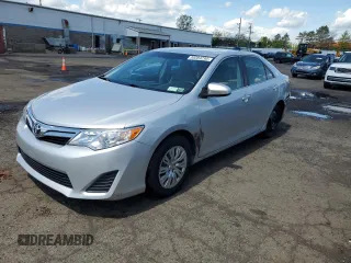 2014 Toyota Camry L with VIN 4T4BF1FK1ER390579, listed as a Copart auction lot 55284295 with 133,926 mi miles and Salvage Title. Bid and sale history available at DreamBid. Image 1.