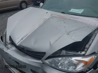 2004 Toyota Camry LE z VIN 4T1BE32KX4U842784, wystawiony jako IAAI lot #40434823 z przebiegiem 119 021 mil mil oraz . Historia ofert i sprzedaży dostępna na DreamBid. Obrazek 10.