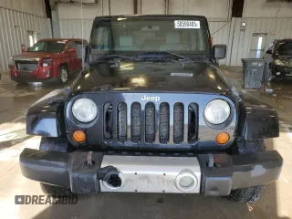 2008 Jeep Wrangler Unlimited Sahara with VIN 1J4GA59198L623643, listed as a Copart auction lot 50590485 with 198,000 mi miles and Non Repairable. Bid and sale history available at carsss.com. Image 5.