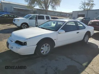 1994 Ford Thunderbird LX with VIN 1FALP62WXRH217279, listed as a Copart auction lot 80512504 with 176,798 mi miles and Salvage Title. Bid and sale history available at DreamBid. Image 1.