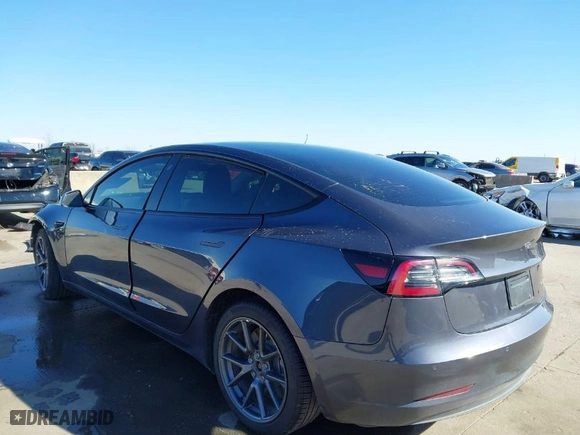 2022 Tesla Model 3 Long Range with VIN 5YJ3E1EB9NF197127, listed as a IAAI auction lot 41366323 with 56,559 mi miles. Bid and sale history available at carsss.com. Image 3.