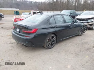 2020 BMW 3 Series M340i with VIN WBA5U7C02LAF54184, listed as a IAAI auction lot 41490697 with 57,363 mi miles. Bid and sale history available at carsss.com. Image 4.