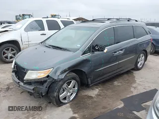 2012 Honda Odyssey Touring with VIN 5FNRL5H96CB138548, listed as a IAAI auction lot 41471856 with 186,284 mi miles and . Bid and sale history available at DreamBid. Image 2.