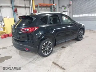 2016 Mazda CX-5 Grand Touring with VIN JM3KE2DY9G0635368, listed as a IAAI auction lot 41699616 with 240,619 mi miles. Bid and sale history available at carsss.com. Image 4.