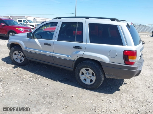 2002 Jeep Grand Cherokee Laredo with VIN 1J4GW48S42C324297, listed as a IAAI auction lot 42050957 with 135,542 mi miles. Bid and sale history available at carsss.com. Image 3.