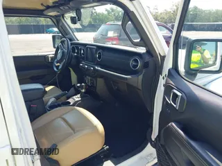2018 Jeep Wrangler Unlimited Sahara with VIN 1C4HJXEG6JW112976, listed as a IAAI auction lot 42559123 with 76,066 mi miles and . Bid and sale history available at DreamBid. Image 5.