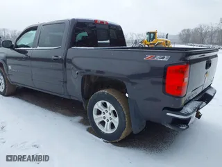 2015 Chevrolet Silverado 1500 LT with VIN 3GCUKREC3FG460485, listed as a IAAI auction lot 41616998 with 128,049 mi miles. Bid and sale history available at carsss.com. Image 3.