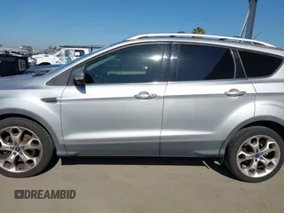 2015 Ford Escape Titanium with VIN 1FMCU0J90FUA43720, listed as a IAAI auction lot 42541048 with 98,948 mi miles and . Bid and sale history available at DreamBid. Image 14.