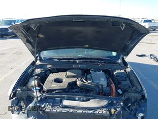2016 Ford Fusion Titanium Hybrid with VIN 3FA6P0RU6GR156622, listed as a IAAI auction lot 41178887 with 92,423 mi miles. Bid and sale history available at carsss.com. Image 10.