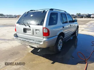 2002 Isuzu Rodeo S with VIN 4S2CK58WX24321556, listed as a IAAI auction lot 41405981 with 172,590 mi miles and . Bid and sale history available at DreamBid. Image 4.