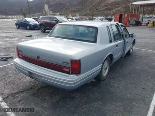 1993 Lincoln Town Car Executive with VIN 1LNLM81W6PY618899, listed as a IAAI auction lot 41566437 with 158,821 mi miles. Bid and sale history available at carsss.com. Image 4.