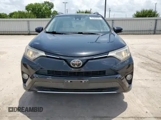 2018 Toyota RAV4 XLE with VIN 2T3WFREV2JW433186, listed as a Copart auction lot 61008705 with 57,310 mi miles and Salvage title. Bid and sale history available at DreamBid. Image 5.