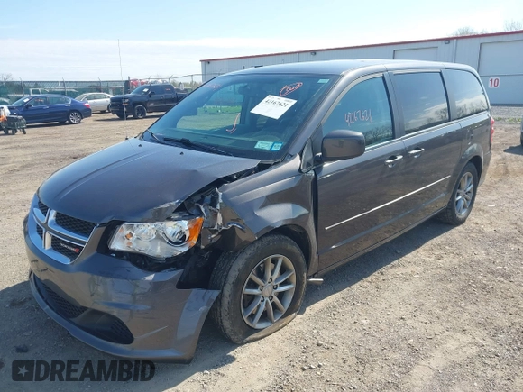 2015 Dodge Grand Caravan SE with VIN 2C4RDGBG2FR684367, listed as a IAAI auction lot 42167621 with 216,628 mi miles and . Bid and sale history available at DreamBid. Image 2.